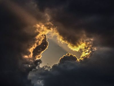 Dynamic light rays breaking through dark atmosphere