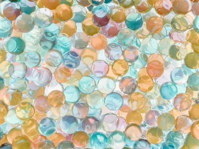 Geometric crystal shapes reflecting cyan light